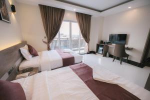 Twin Hotel Kampot客房内的一张或多张床位