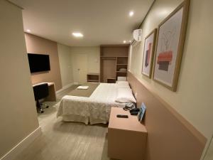 Llit o llits en una habitació de Hotel Marajó
