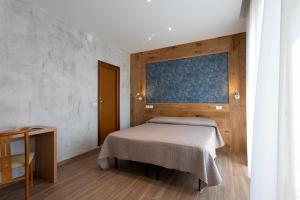 Postel nebo postele na pokoji v ubytování Hotel Rosa
