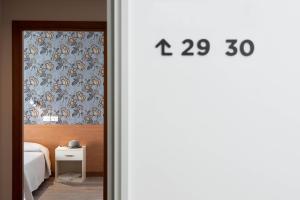 Postel nebo postele na pokoji v ubytování Hotel Rosa