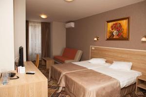 A bed or beds in a room at Hotel Motto