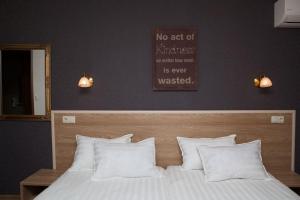 A bed or beds in a room at Hotel Motto