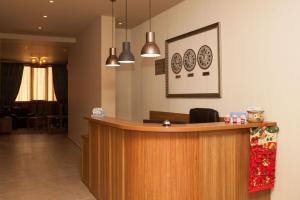 a lobby with a reception desk in a room at Hotel Motto in Stara Zagora