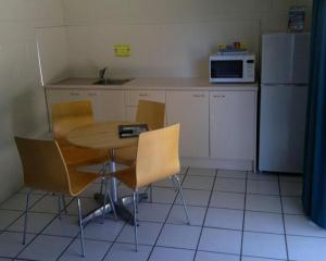 A kitchen or kitchenette at Whitsunday on The Beach