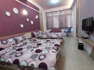 Postelja oz. postelje v sobi nastanitve Nice Neighbors Homestay
