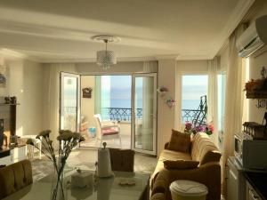 a living room with a couch and a table at Trabzon Sea Pearl in Trabzon