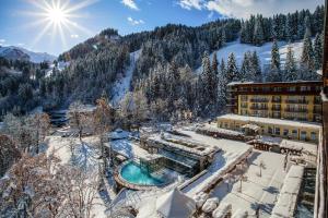 an aerial view of a resort in the snow at Lenkerhof gourmet spa resort - Relais & Châteaux in Lenk