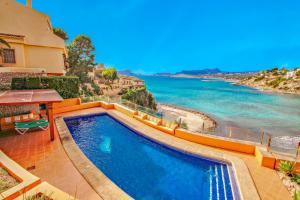 The swimming pool at or close to El Portet - beachfront holiday home with private pool in Moraira