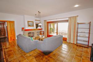 A seating area at El Portet - beachfront holiday home with private pool in Moraira