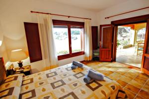A bed or beds in a room at El Portet - beachfront holiday home with private pool in Moraira