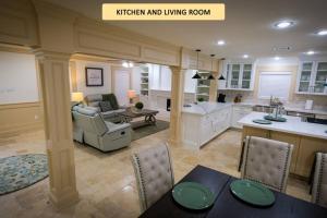 a kitchen and living room with a couch and a table at Downtown - 14 Miles - Cedardale in Houston