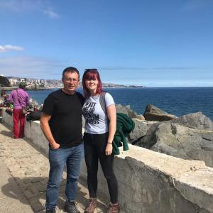 un hombre y una mujer de pie junto al océano en educatefirst en Christchurch