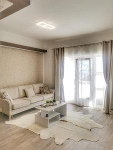 a living room with a couch and a table at Studio Apartment "Brigita",free parking in Rijeka