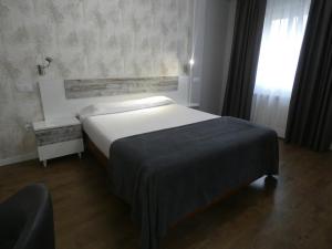 Voodi või voodid majutusasutuse Hotel Vivar toas