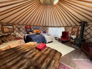 Voodi või voodid majutusasutuse Ngahere Hou Glamping toas