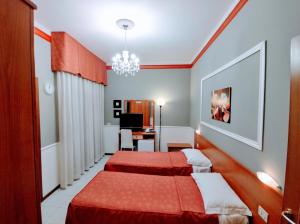 Кровать или кровати в номере Hotel Minerva