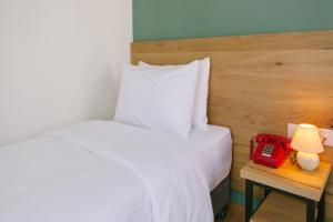 Ένα ή περισσότερα κρεβάτια σε δωμάτιο στο Intourist Kazbegi