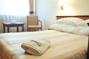 
Łóżko lub łóżka w pokoju w obiekcie Hotel Panorama
