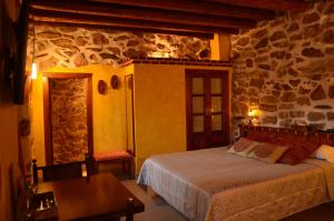 Postel nebo postele na pokoji v ubytování Hotel La Beltraneja
