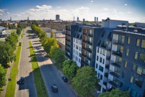 an aerial view of a city street with buildings at FITNESS room, Air conditioner, security & PARKING, fully equipped kitchen & washing machine, 4K OLED TV & HighSpeed WiFi, spacious balcony with gorgeous city view in CENTRAL location in Riga