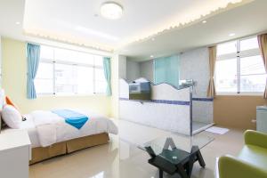 Ένα ή περισσότερα κρεβάτια σε δωμάτιο στο Mu Yu B&B