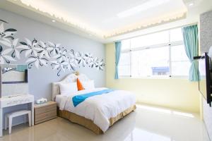 Ένα ή περισσότερα κρεβάτια σε δωμάτιο στο Mu Yu B&B