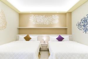 Ένα ή περισσότερα κρεβάτια σε δωμάτιο στο Mu Yu B&B