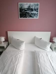 Postel nebo postele na pokoji v ubytování Hotel Altes Badehaus