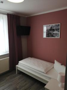 Postel nebo postele na pokoji v ubytování Hotel Altes Badehaus