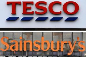 a sign for a tesco santos store at Aisiki Living at Upton Rd, Multiple 1, 2, or 3 Bedroom Apartments, King or Twin beds with FREE WIFI and FREE PARKING in Watford