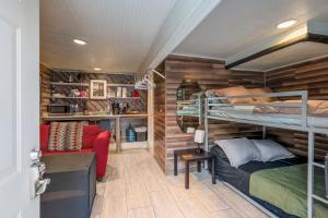 a room with two bunk beds and a couch at East Downtown Modern Cabin in Houston