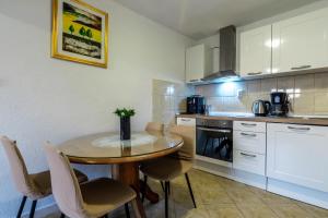 A kitchen or kitchenette at Hidden villa Nancy with swimming pool
