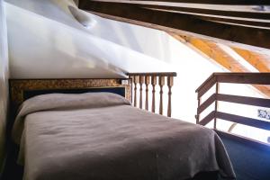 Postel nebo postele na pokoji v ubytování Hotel Villa Pigalle