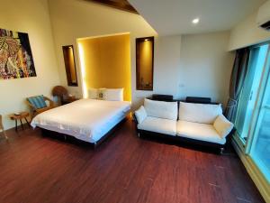 A bed or beds in a room at After the Court Chiaohsi