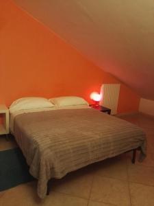 Ένα ή περισσότερα κρεβάτια σε δωμάτιο στο Colle dell'Ara