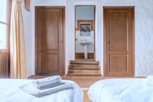 A bed or beds in a room at Hotel Almejí
