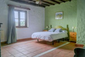 A bed or beds in a room at Hotel Almejí