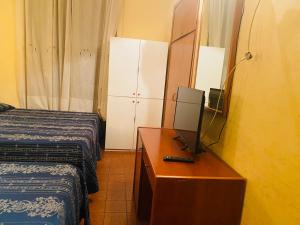 Postel nebo postele na pokoji v ubytování Hotel Ferrari