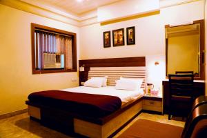 Krevet ili kreveti u jedinici u okviru objekta Hotel Prayag