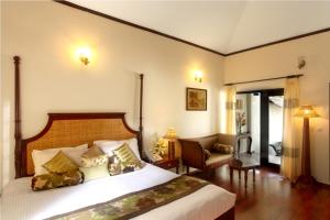 Postel nebo postele na pokoji v ubytování Carmelia Haven Resort Thekkady