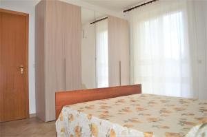 A bed or beds in a room at Etna - Taormina