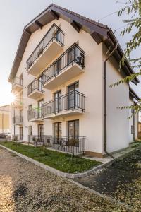 an exterior view of a building with balconies at Studio Roberta Coressi in Braşov