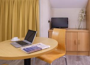 a laptop sitting on a table in a room at Residence Portello in Milan