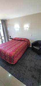 Postel nebo postele na pokoji v ubytování Aspree Motor Inn