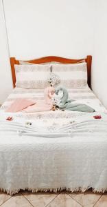 Łóżko lub łóżka w pokoju w obiekcie Pousada e Hostel Chapada Suites