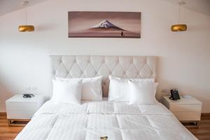 Postel nebo postele na pokoji v ubytování Adamas House Hotel Boutique