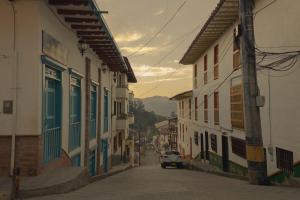 a street with buildings and a car driving down a street at Hotel Felicina in Jeric&oacute;
