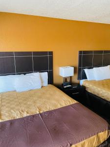 Postel nebo postele na pokoji v ubytování Sona Inn