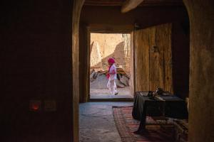 a person walking through a doorway in a room at Dar Bladi in Ouarzazate +16 photos