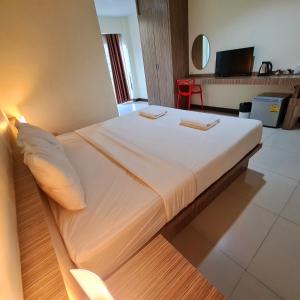 מיטה או מיטות בחדר ב-Le' Luxe Residence